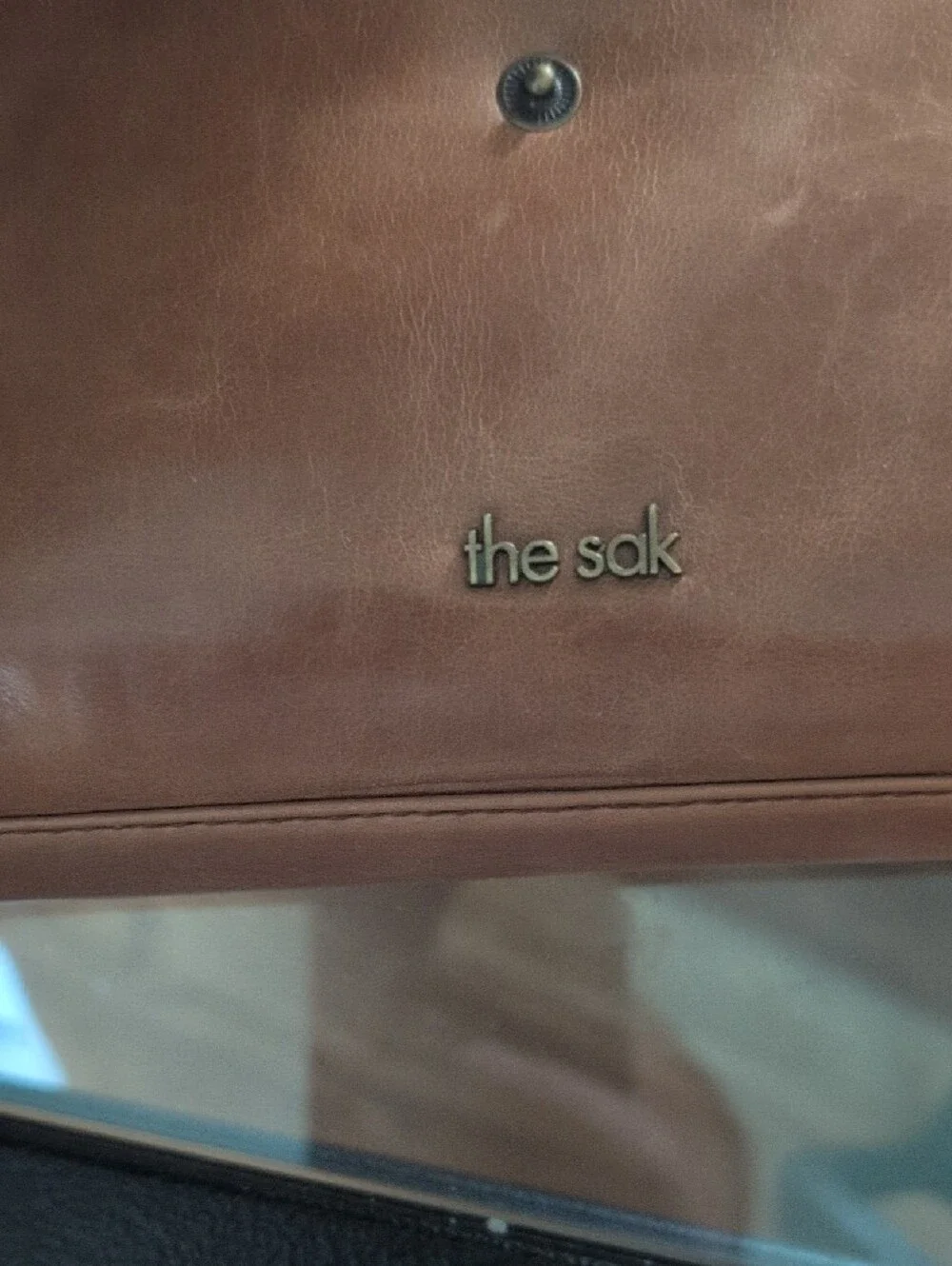 The Sak Tan Leather Wristlet Wallet with Brass Accents